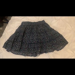The cutest navy skirt with colored flowers on it